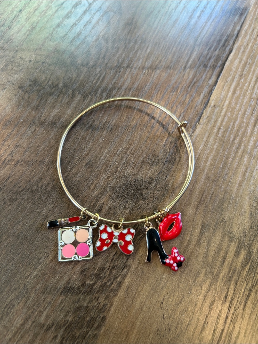 Gold-Tone Charm Bangle Bracelet with Red, Black and Pink Charms